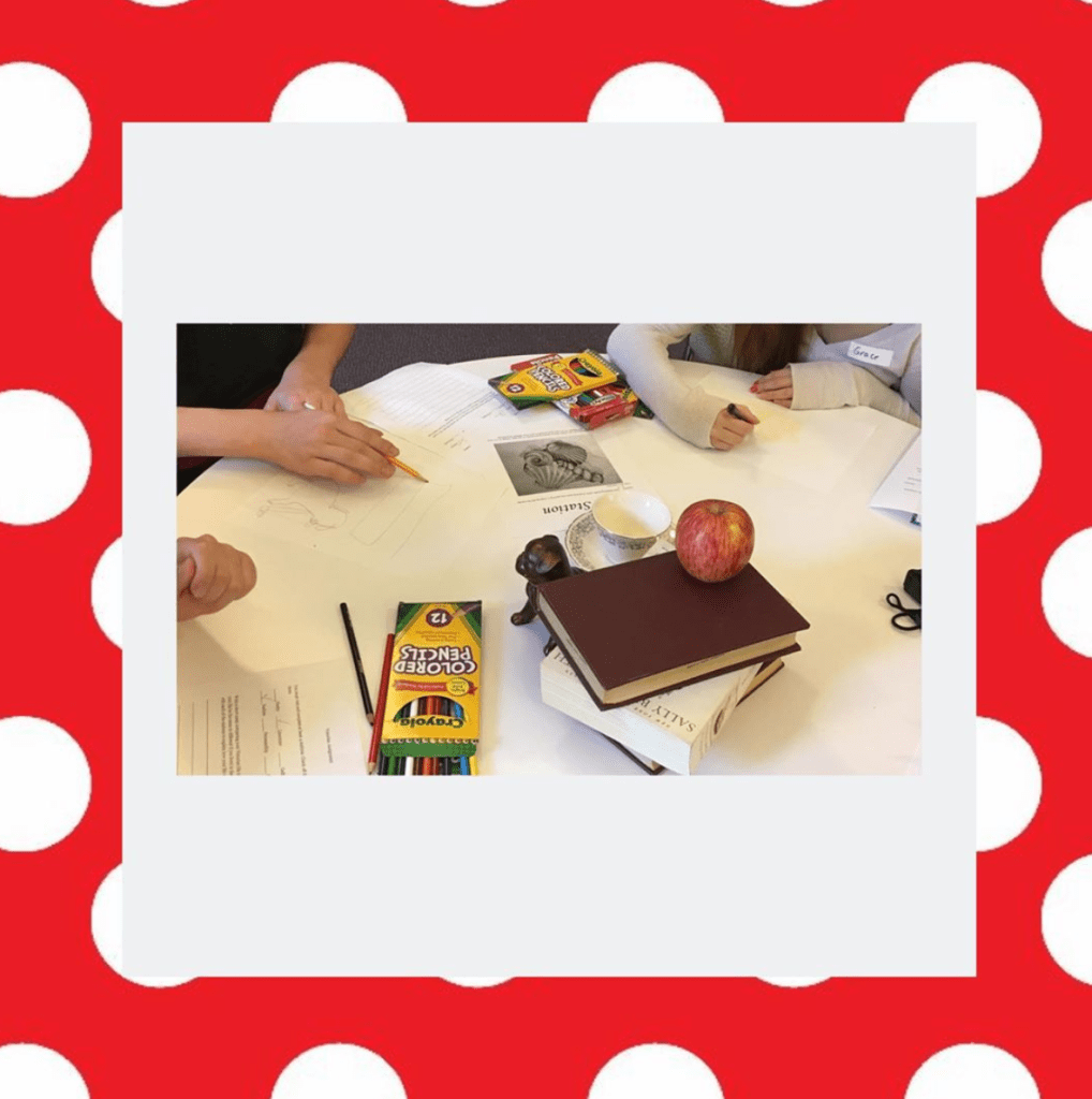 Students sketching still life drawings.